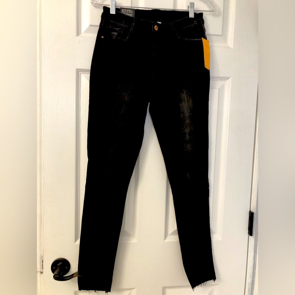 Distressed black jeans by Divided